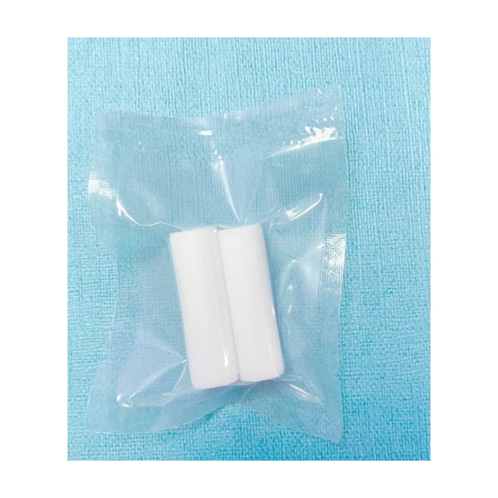 Two white aligner chewies in a sealed product pack