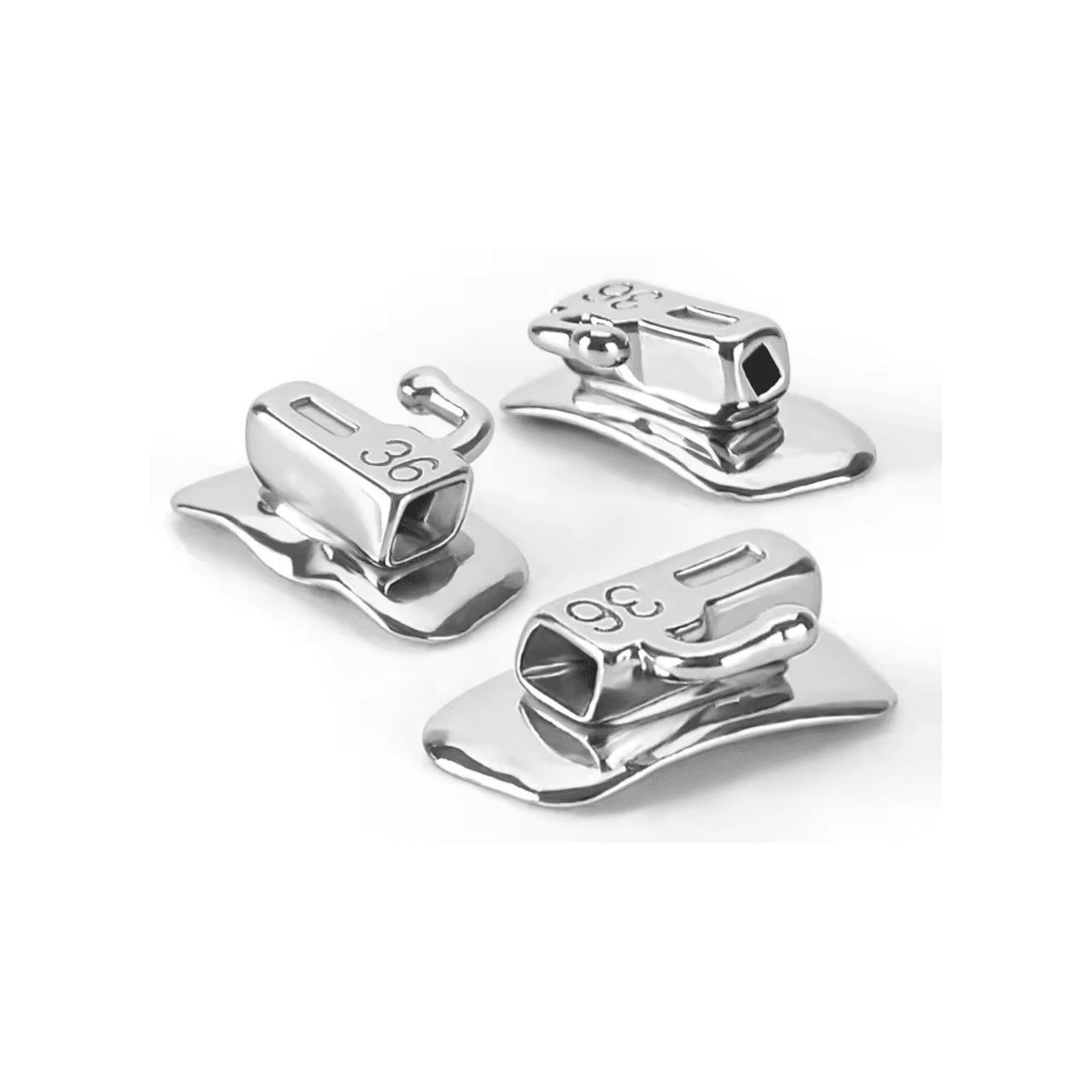 Bondable orthodontic buccal tubes with hooks on a white background