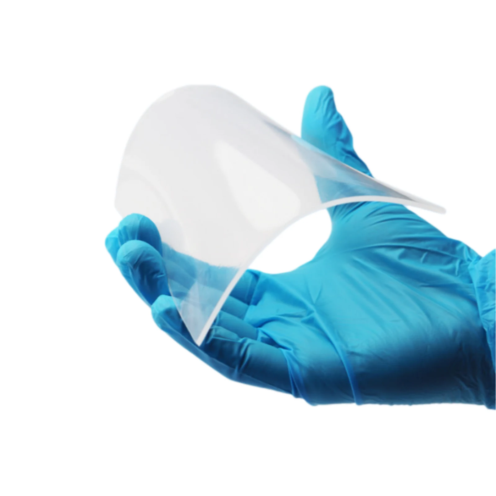 Clear dental thermoforming sheet held by gloved hands